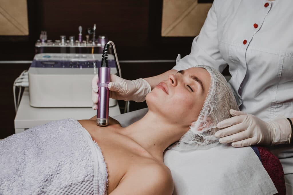CO2 fractional laser resurfacing treatment on patient's face