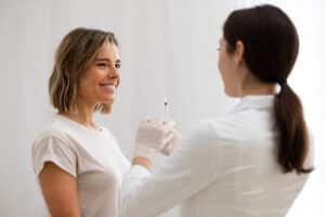 Fat dissolving injection being administered to chin and jawline area